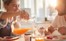 Happy,Couple,Having,Breakfast,Together,In,The,Kitchen